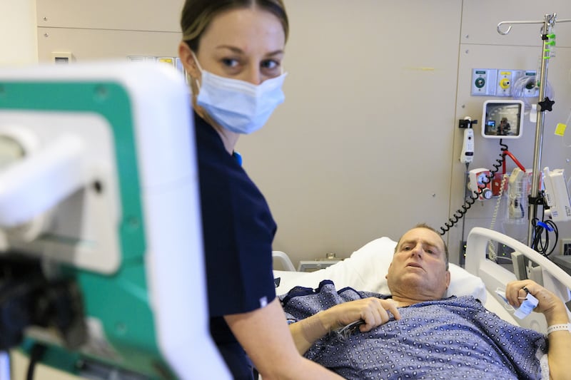 Nurse Melanie Brodner monitors Mr Andrews four days after his surgery
