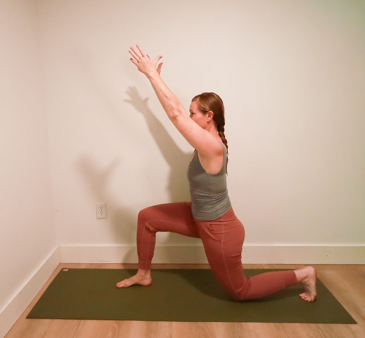 Woman demonstrates yoga pose
