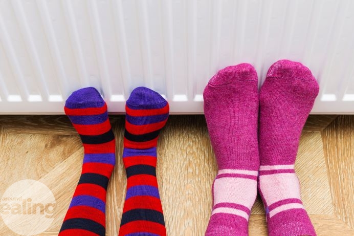 feet in cosy socks against a radiator