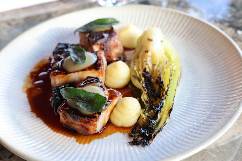 Roasted salters rare breed pork loin, charred hispi cabbage, buttery mash and bramley apple cider jus at The Leopardstown Inn. Photograph: Dara Mac Dónaill / The Irish Times