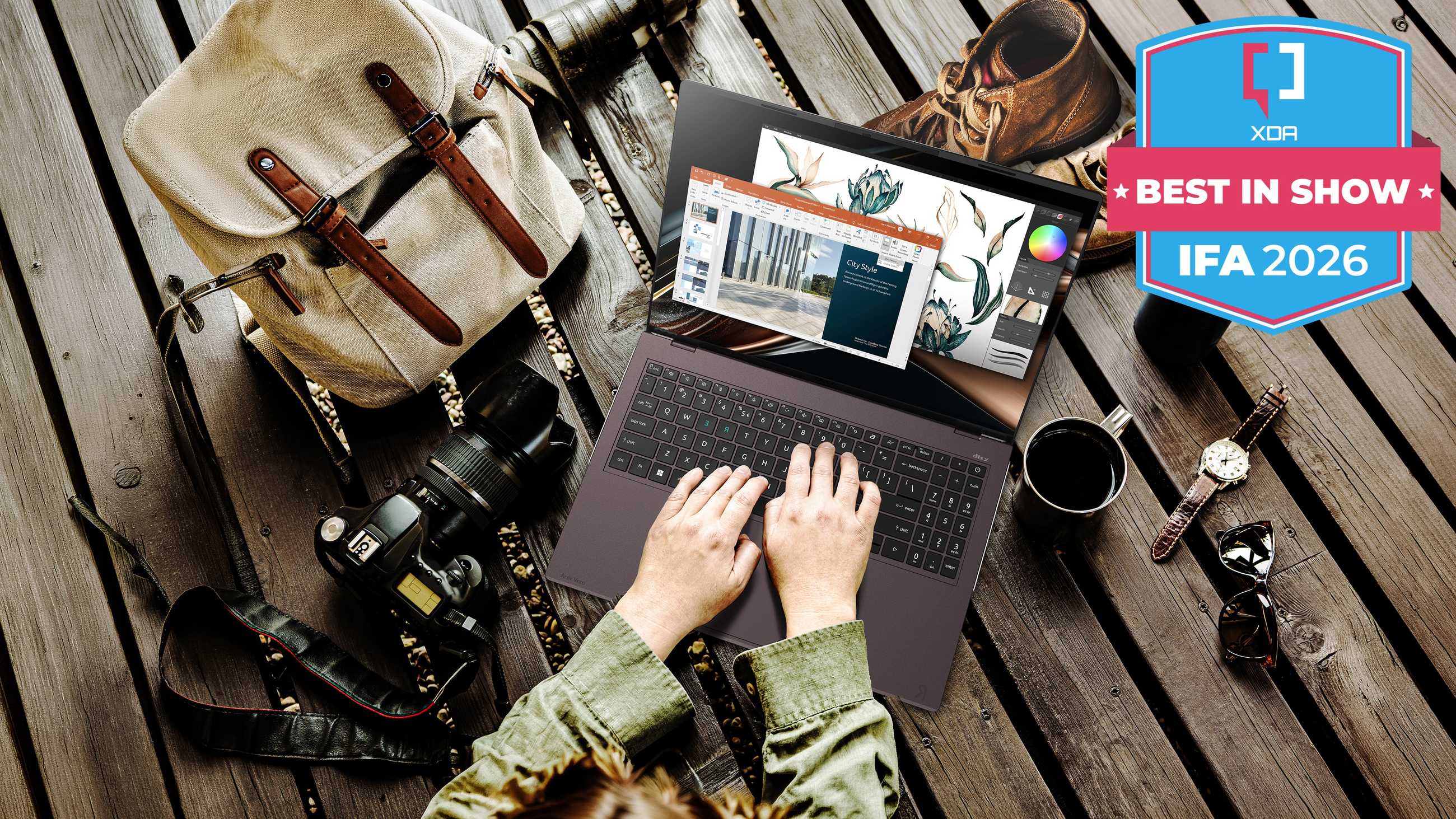 An Acer Vero 16 surrounded by various gadgets and household items