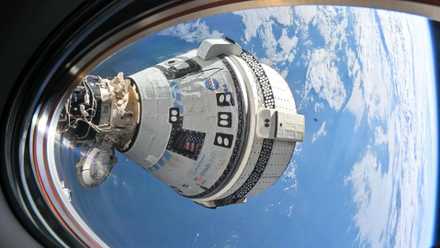 Boeing’s Starliner spacecraft is pictured docked to the Harmony module’s forward port at the International Space Station