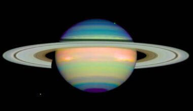 A false colour image of Saturn by the Hubble Space Telescope, showing the ringed planet in reflected infrared light. Different colours show varying heights and compositions of cloud layers thought to consist of ammonia ice crystals. Credit: NASA/E. Karkoschka (University of Arizona)