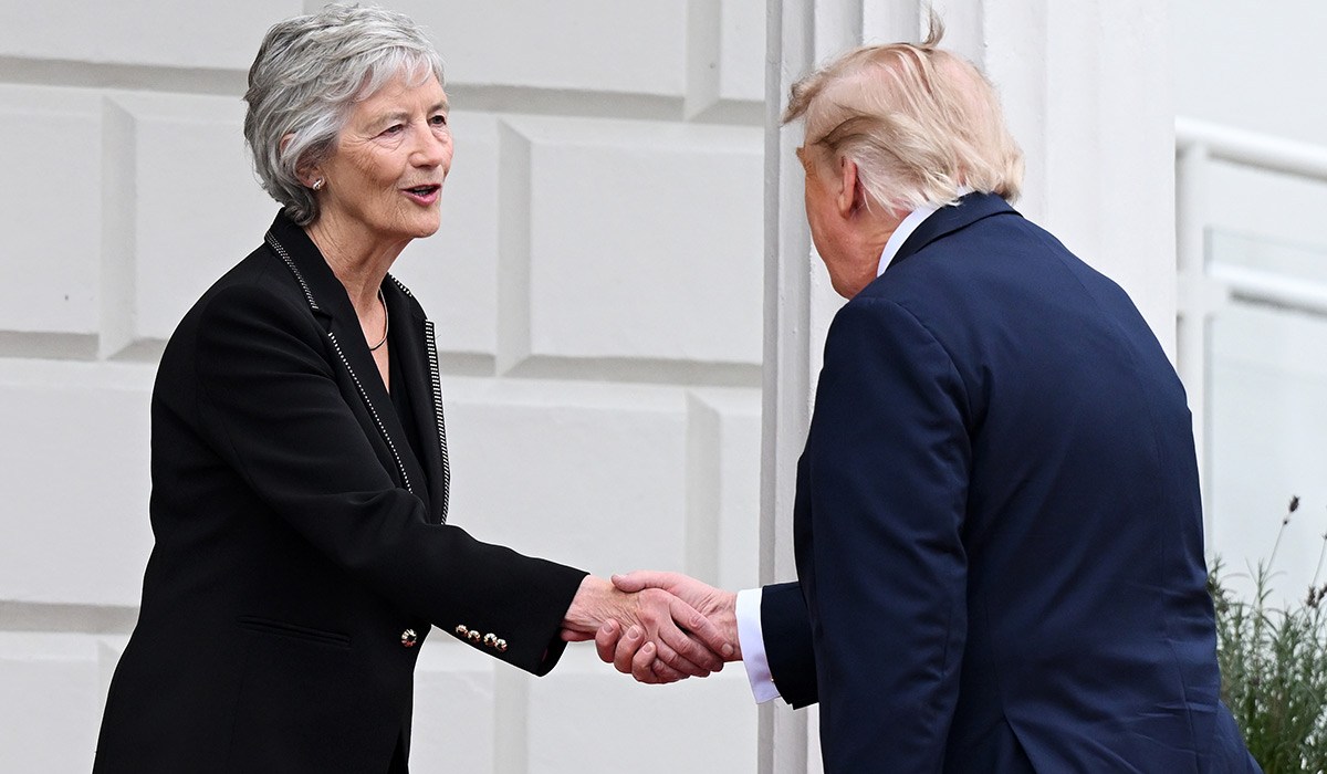 President Donald Trump is greeted by Irish President Catherine Connolly during an arrival ceremony. Pic: Getty Images