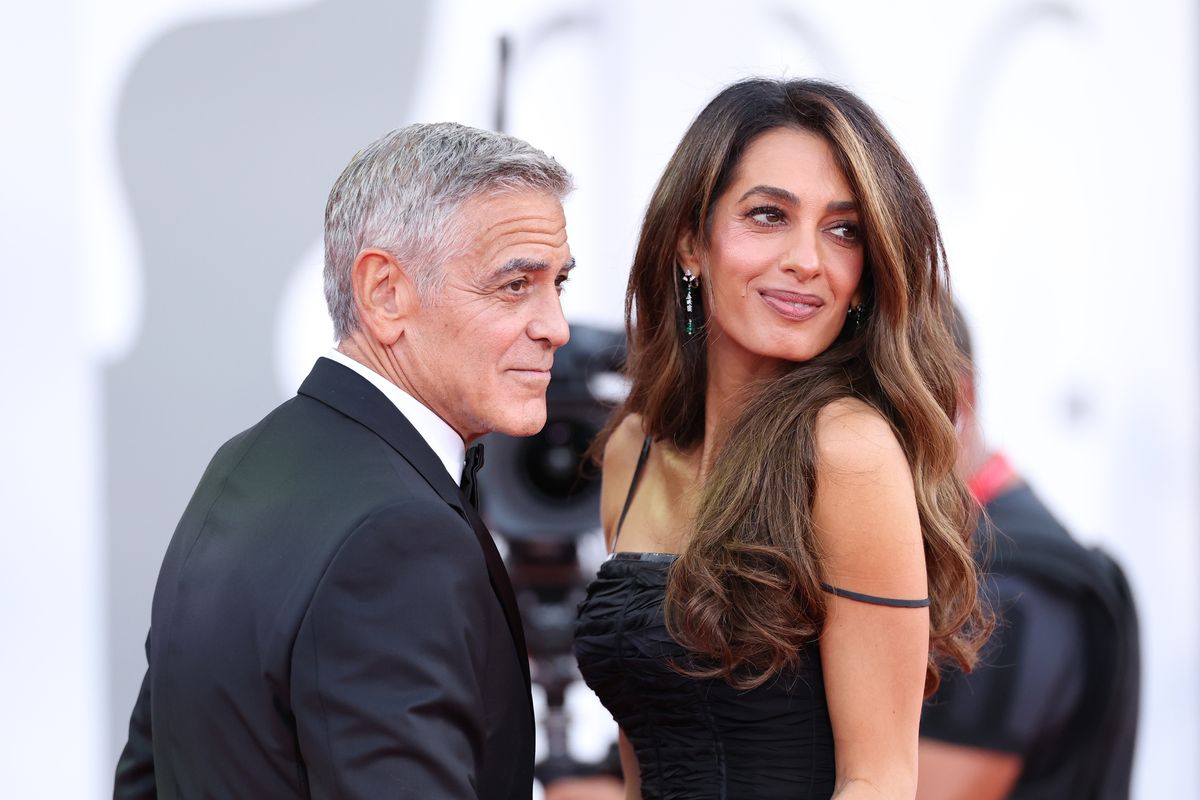 Amal Clooney makes glamorous red carpet return and shares tender moment with George