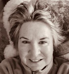 Black and white head shot of author Maureen B. Roberts