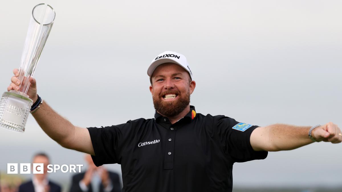 Shane Lowry poses with the trophy