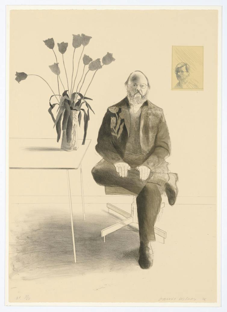 Framed portrait of a balding man sitting beside a table with a vase of tulips, in grey tones.