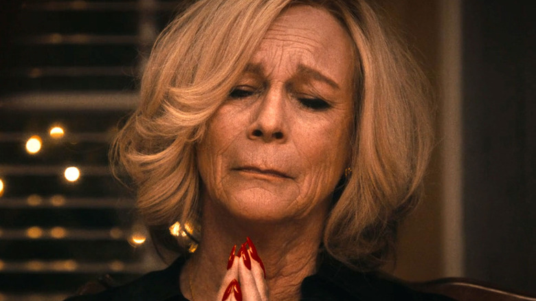 Jamie Lee Curtis as Donna Berzatto, praying with eyes closed in The Bear.