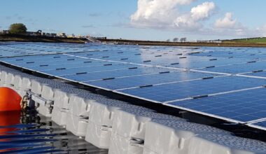 Rows of floating solar panels on a reservoir near London