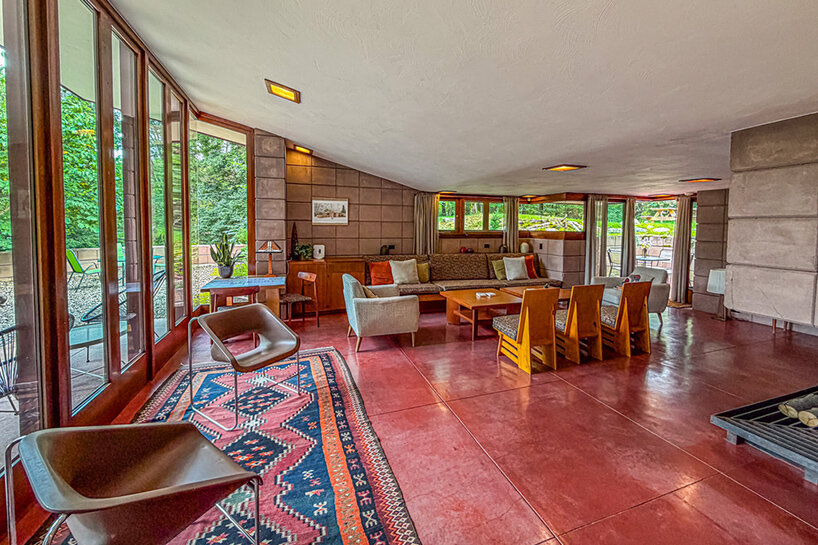 cantilevered roof extends over frank lloyd wright’s concrete usonian house - 5