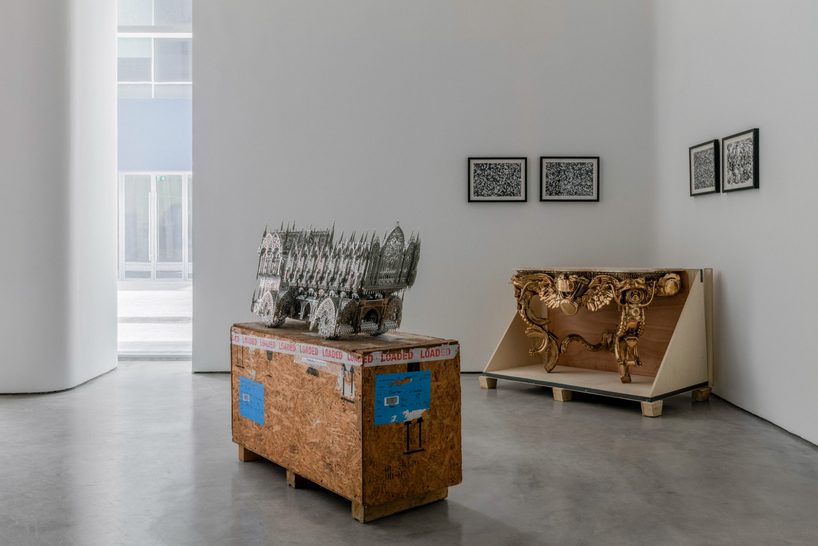 dubai gallery pairs open white exhibition halls with a concealed, brick-toned museum room - 5