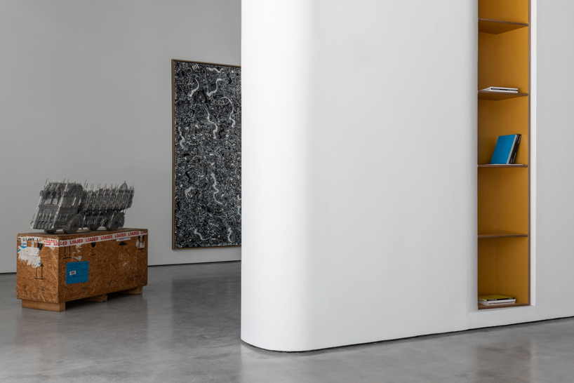 dubai gallery pairs open white exhibition halls with a concealed, brick-toned museum room - 6