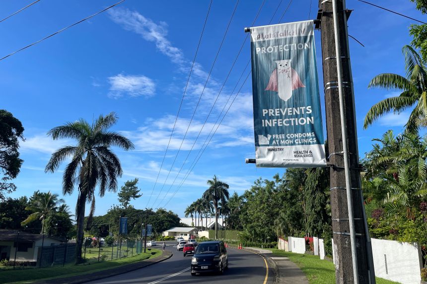 An HIV awareness poster displayed along a main road in Suva, Fiji, on March 19, 2026.