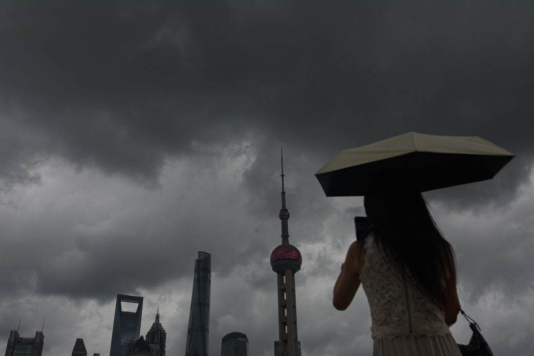 General view of tourists taking selfies at North Bund in Shanghai, China, as Typhoon Dolphin approaches the country on August 8, 2026.