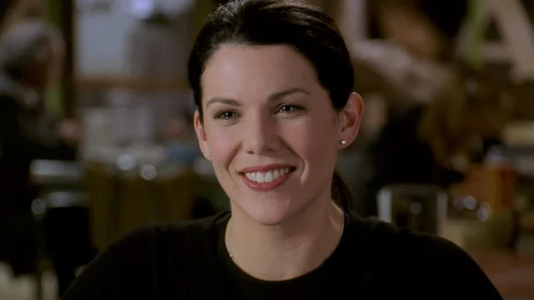 Lorelai Gilmore smiling and wearing a black shirt