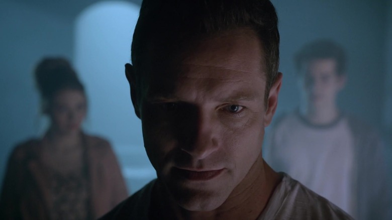Peter Hale broods in a dark room in 
