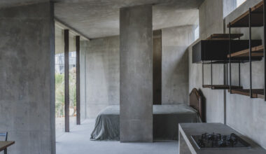 overlapping concrete walls and columns blur inside and outside in okinawa house