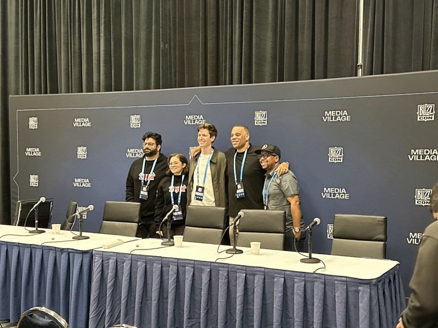 Overwatch developers posing for pictures after a panel