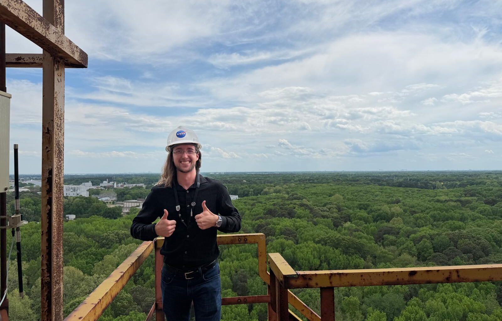 Jaden Caradine standing atop the gantry at NASA Langley's Impact Dynamics Facility