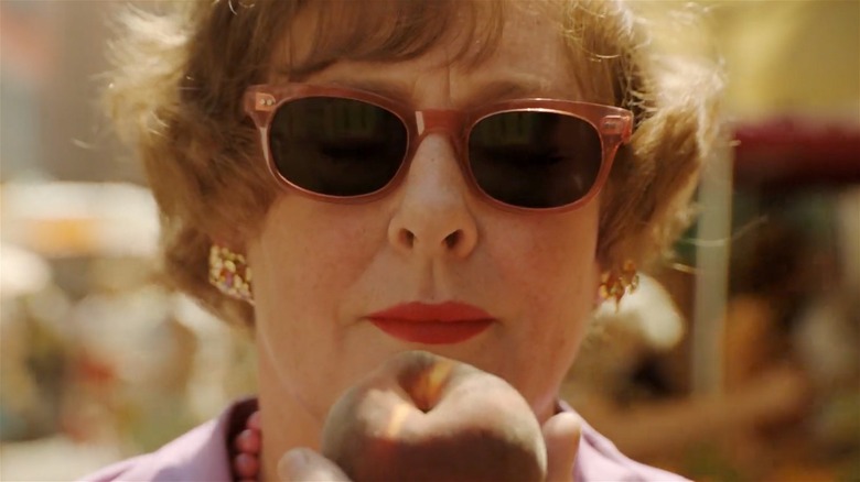 Julia Child smelling a peach