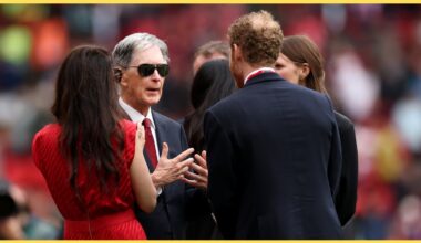 John Henry in discussion on the touchline at Anfield