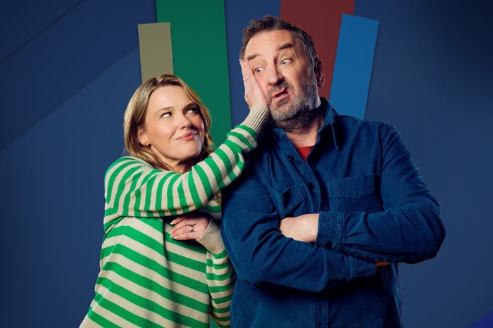 Sally Bretton as Lucy and Lee Mack as Lee in Not Going Out Sally Bretton as Lucy, wearing a green and white striped top, and Lee Mack as Lee, wearing a blue shirt, with her hand pressed against his cheek and him pulling a funny face.