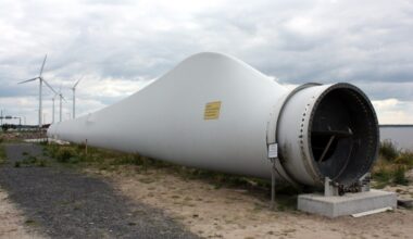 At Denmark’s Port of Aalborg, designers cut a retired wind-turbine blade into a curved roof that now shelters bicycles — a second life for the composite piece turbines can’t easily recycle