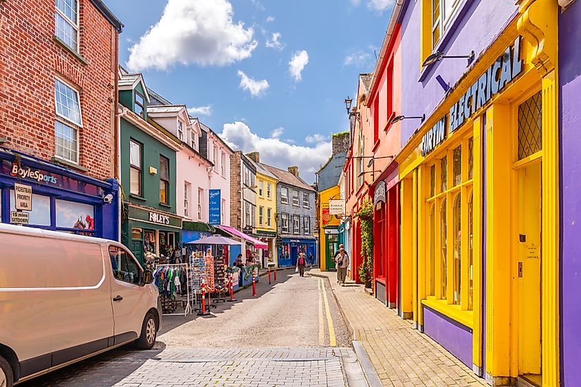 Narrow streets lined with brightly painted shops and cafes in the centre of Kinsale, County Cork.