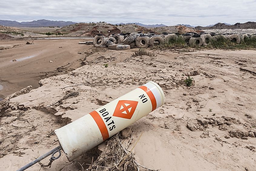 A reservoir dropped well below its normal shoreline during drought.