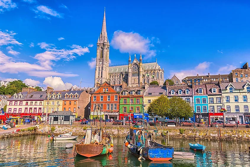 Fishing boats inside the port of Cobh, a city with colorful houses in Ireland.
