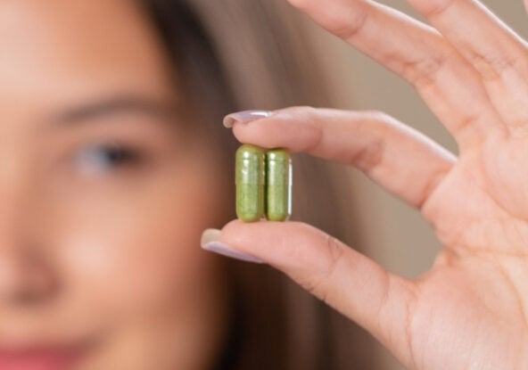 woman holding supplements