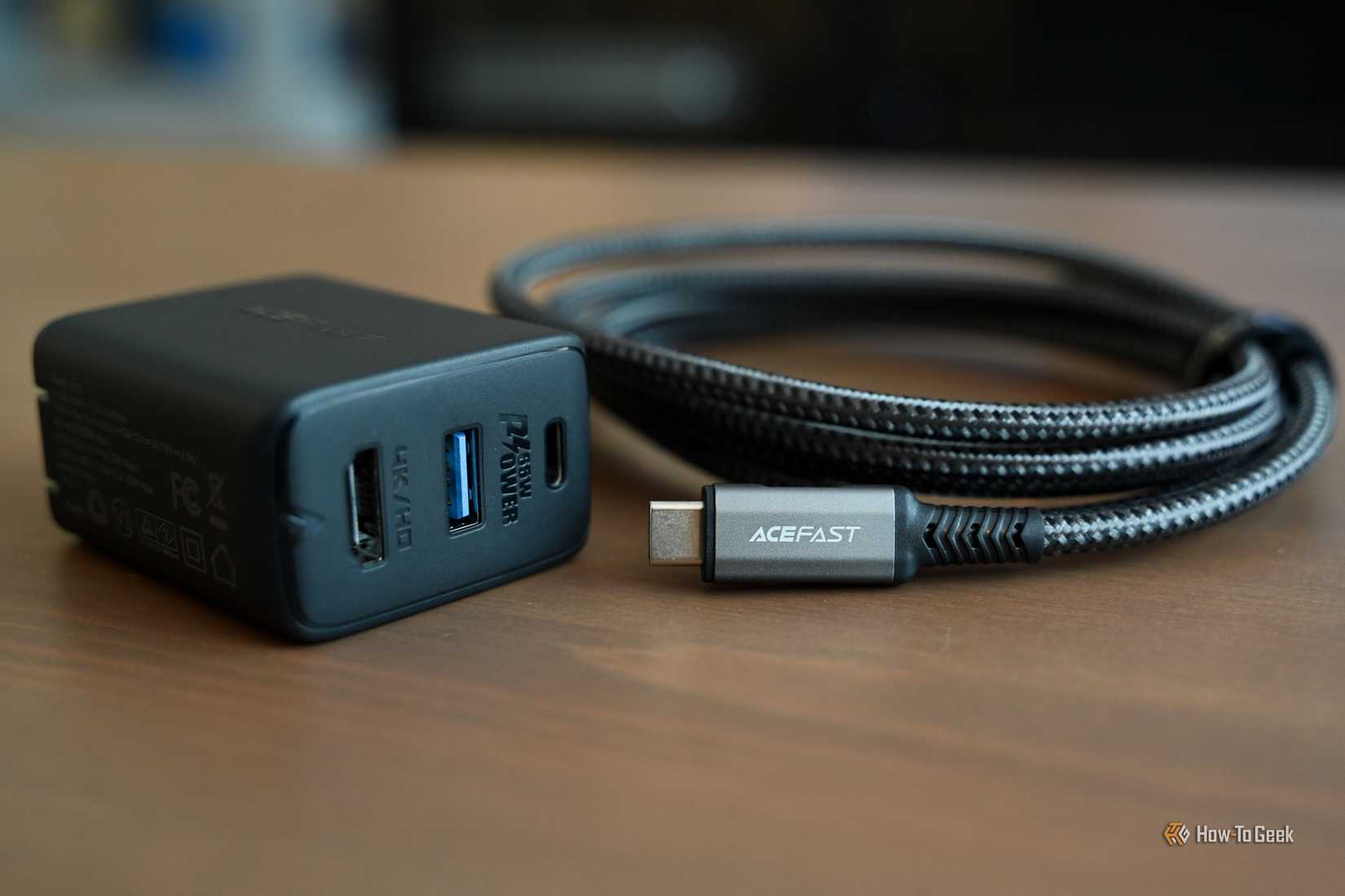 The ACEFAST GaN PD65W 3 Port Fast Charger Hub with its cable