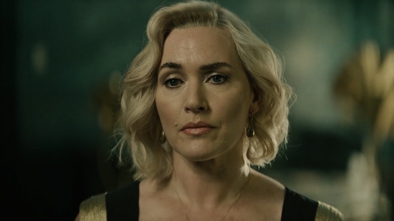 Kate Winslet as Elena frowning in a dress in The Regime