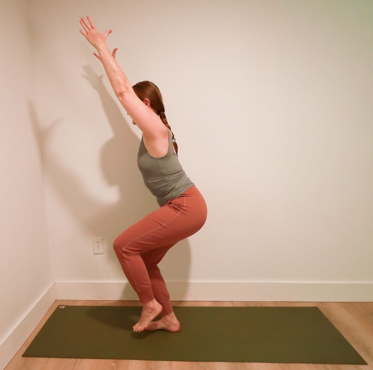 Woman demonstrates yoga pose