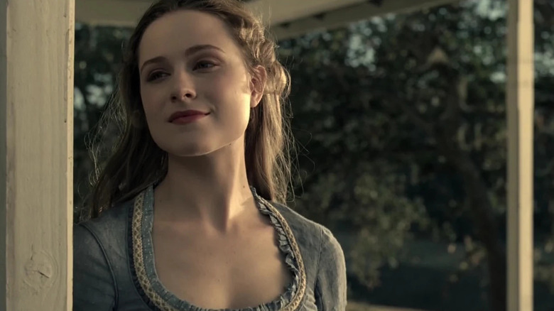 Evan Rachel Wood as Dolores smiling on a porch in Westworld