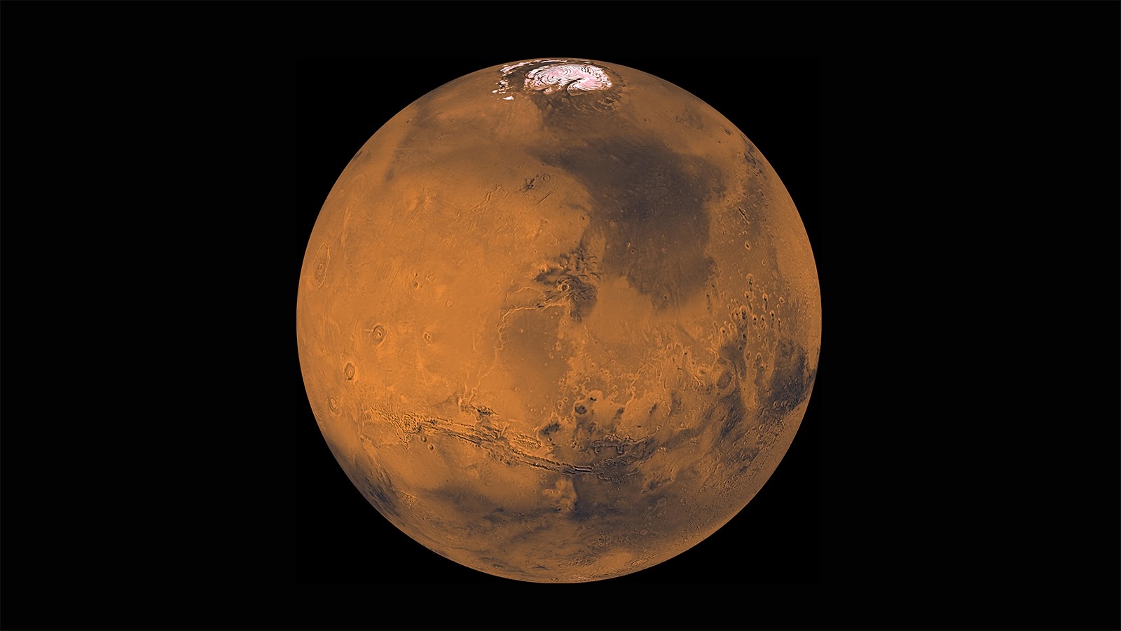 A reddish sphere against a dark background with a white cap on the top.
