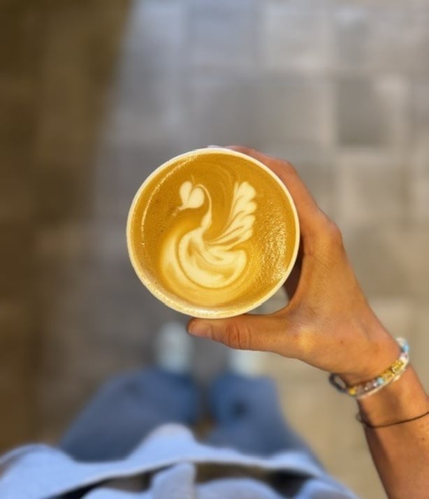 A cup of coffee with elaborate latte art