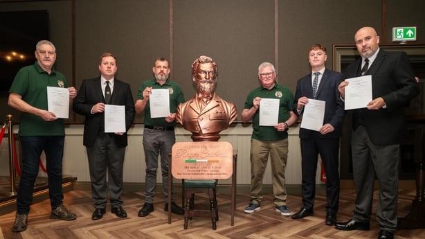 Members of the Roger Casement Commemoration and Reinterment Association with copies of the application in Belfast tonight