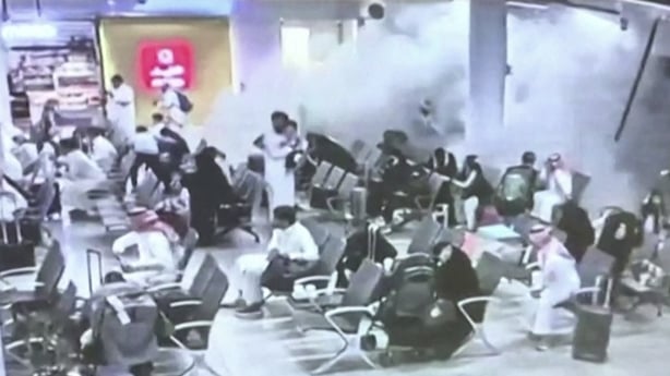 This screen grab taken from CCTV footage played on a screen during a press conference by the Saudi-led coalition in Riyadh on October 15, 2026, and made available via AFPTV, shows what the coalition says was a Houthi attack on Abha International Airport on October 7, 2026. Saudi Arabia, the world's 