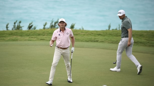 SOUTHAMPTON, BERMUDA - OCTOBER 26: Austin Smotherman of the United States reacts to his par on the 16th green as Seamus Power of Ireland looks on during the first playoff hole in a sudden death playoff after the weather cancelled final round of the Butterfield Bermuda Championship 2026 at Port Royal