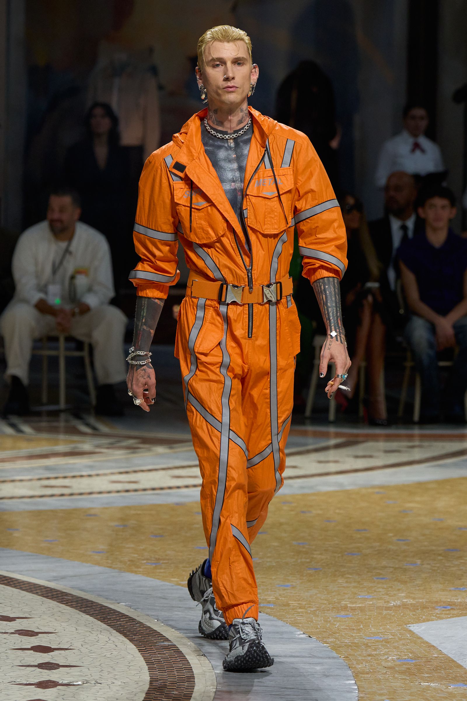 Image may contain Machine Gun Kelly Adult Person Clothing and Coat