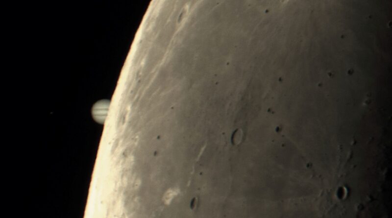 Moon and Jupiter pics: Limb of the moon with craters and striped Jupiter tiny and half hidden behind it.