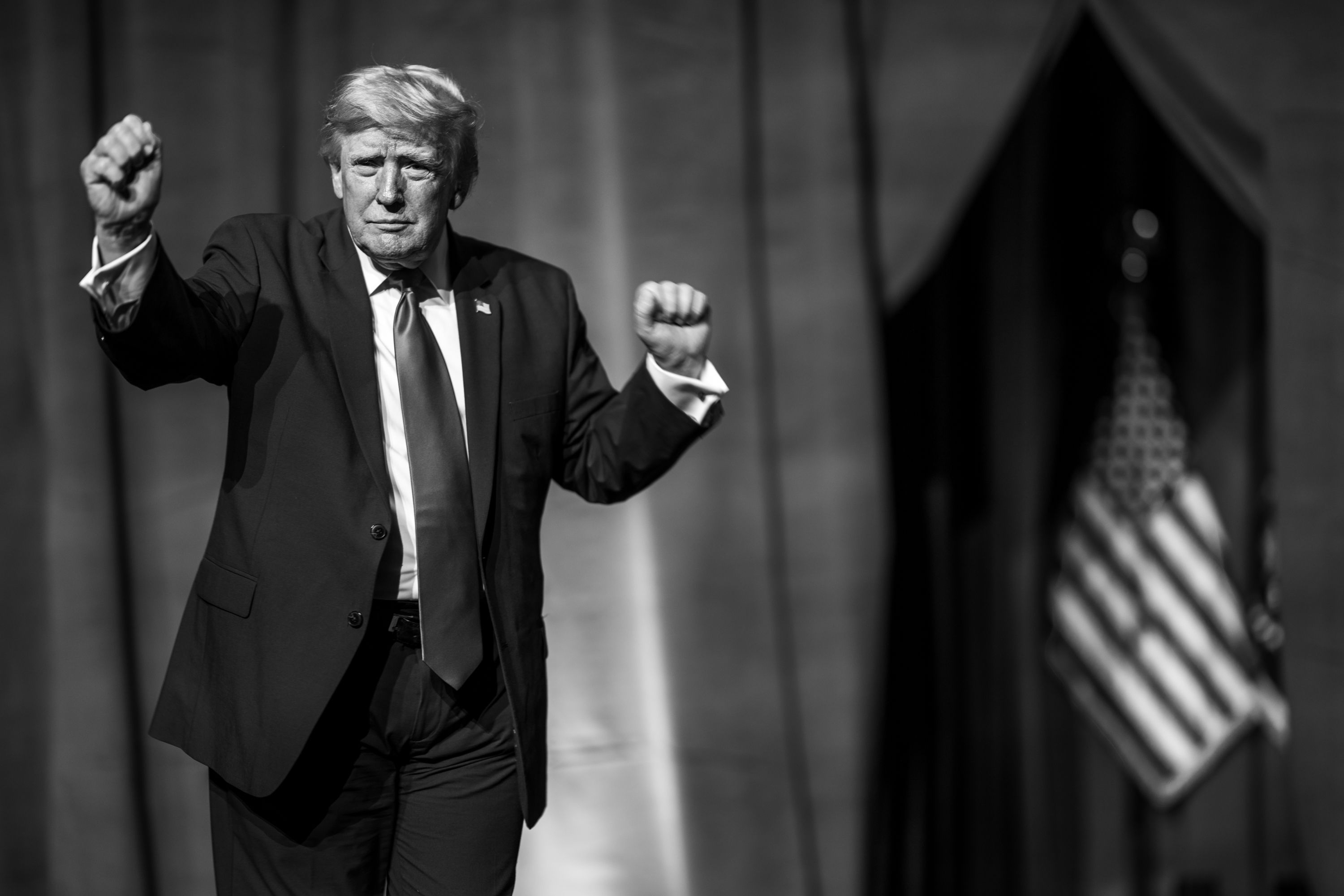 Donald Trump is doing his signature dance while on stage.