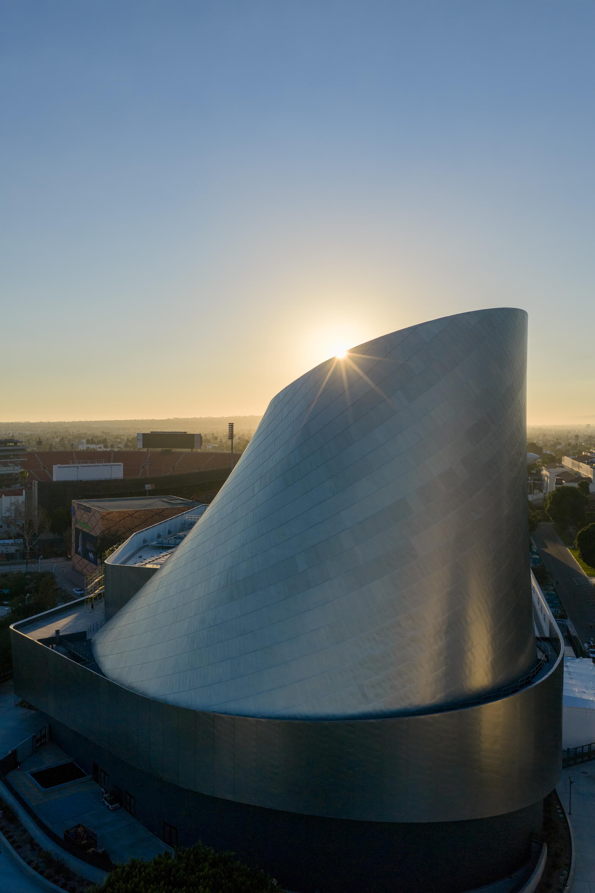 A drone view at sunset of the Samuel Oschin Air and Space Center. 