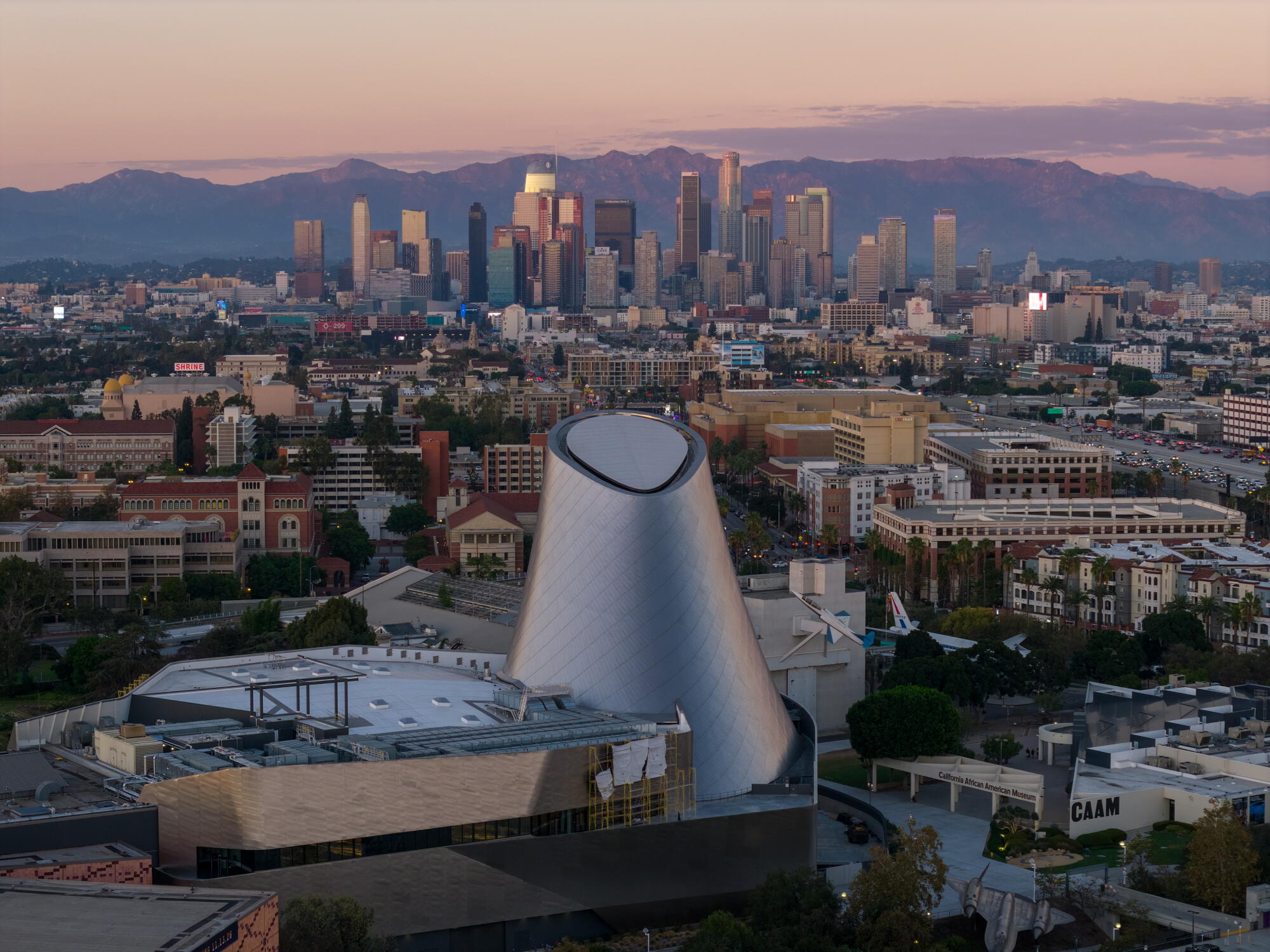 A drone view at sunset of the Samuel Oschin Air and Space Center.