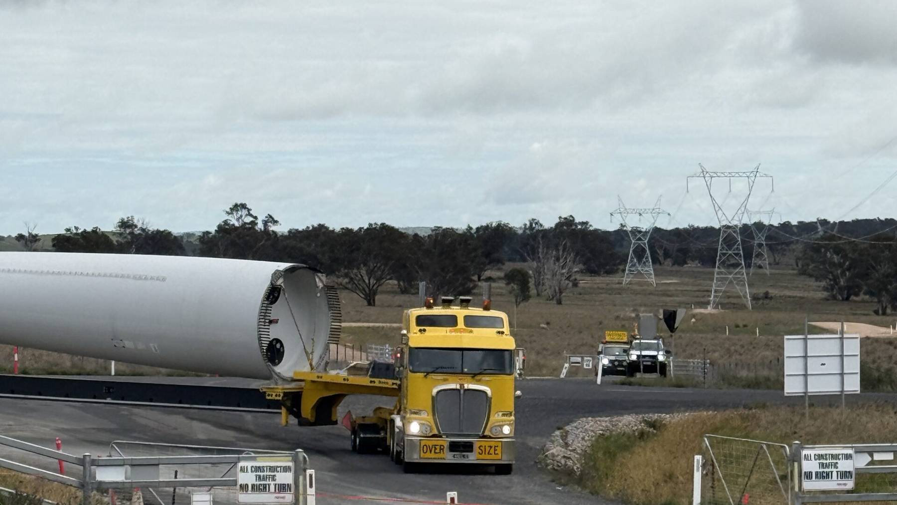 A 213-foot wind turbine blade weighing 22 tons can’t make the right turn at the roundabout outside a McDonald’s in a small Australian town, so the company trucking 141 of them 400 miles inland plans to lay 1,673 feet of new road through the back of town to skip the turn