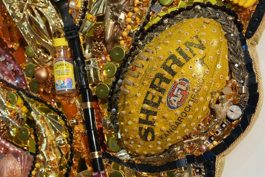 Courtney Act's portrait features found items such as a football and sequins.
