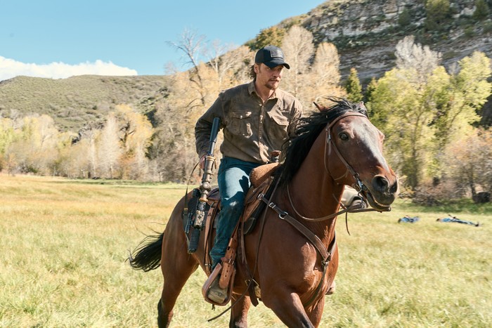 All Hat No Cattle Luke Grimes as Kayce Dutton in Marshals, rising a horse.