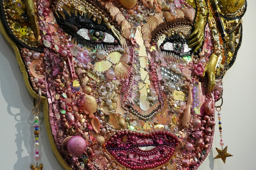 A close up of the portrait of Courtney Act made with found materials.
